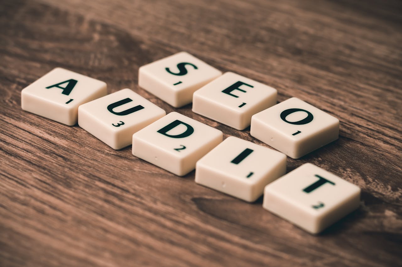 why-choose-us Scrabble tiles spelling SEO Audit on wooden surface, symbolizing digital marketing strategies.